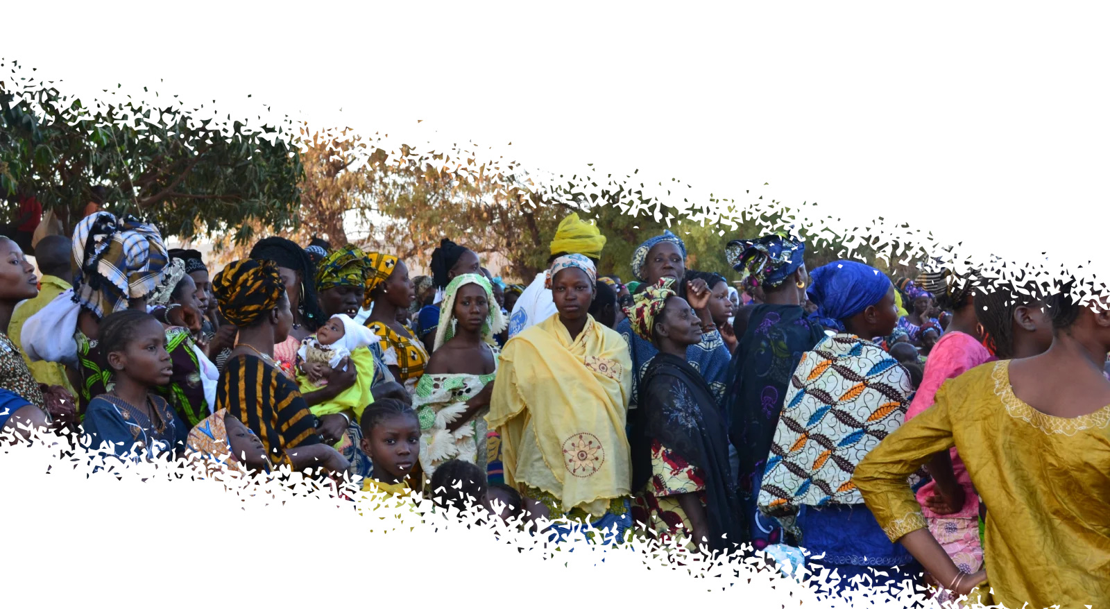 A gathering of people outdoors in colorful dress